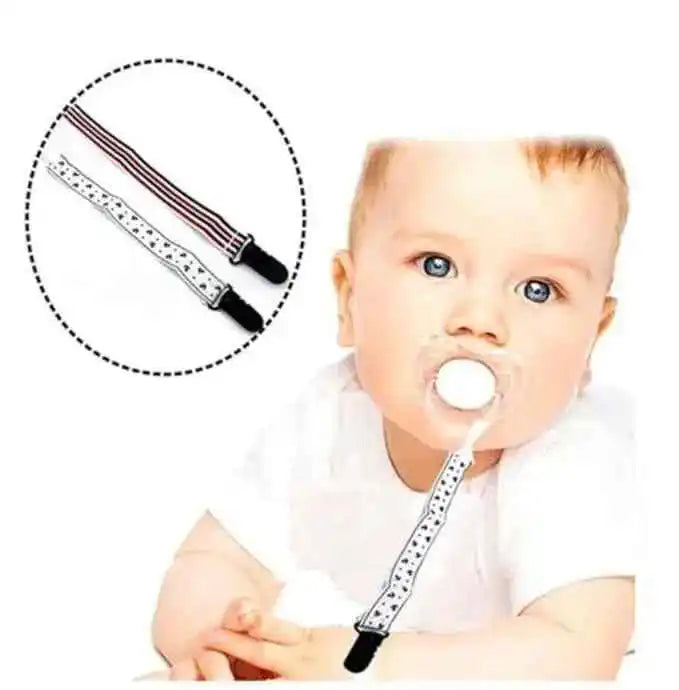 Baby with pacifier and pacifier clip, striped and star-patterned pacifier holder