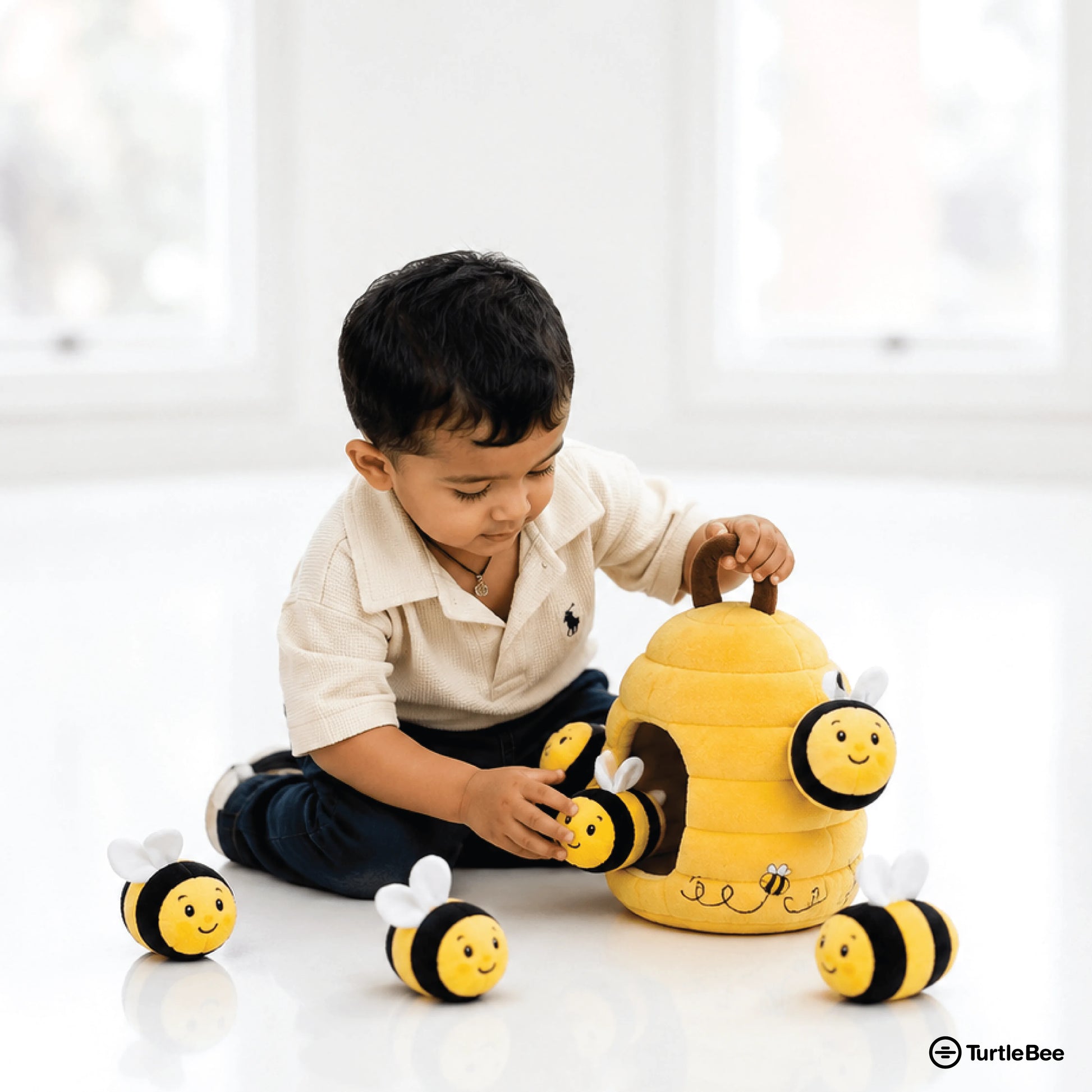 TurtleBee Hide-Seek Sensory Beehive soft plush toy with a cute bee design for babies and toddlers, made from premium plush material.