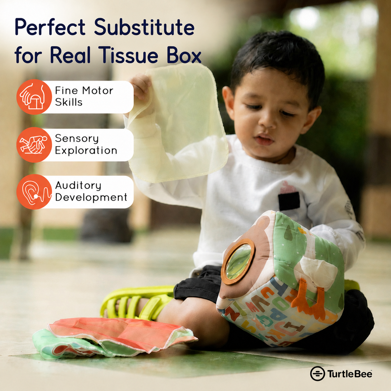 TurtleBee baby soft sensory tissue box toy with colorful fabric and textured surfaces for tactile stimulation and sensory play.