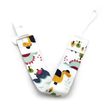 Kids pacifier clip strap with colorful dinosaur print on white fabric