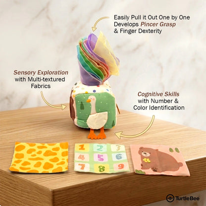 TurtleBee baby soft sensory tissue box toy with colorful fabric and plush turtle design for gentle tactile play.
