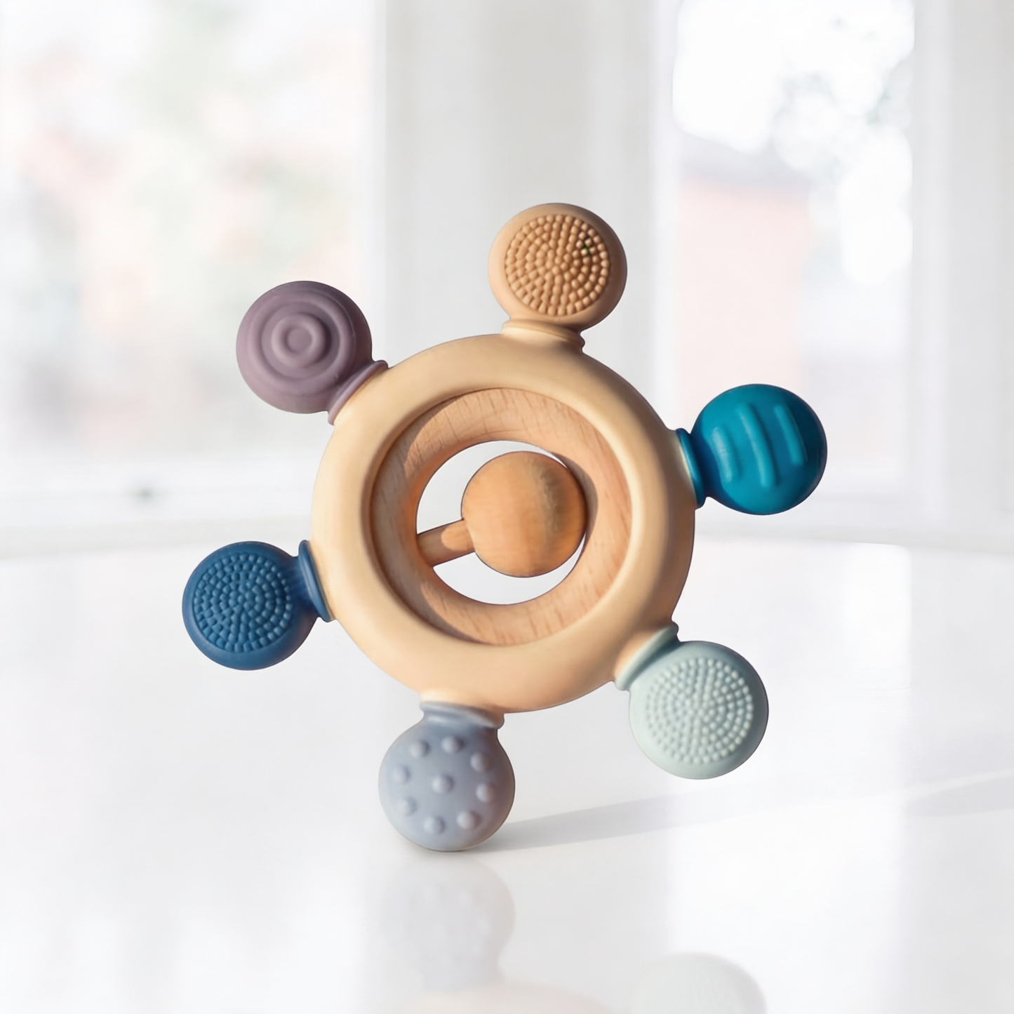 Silicone and wood teether in turtle shape for babies aged 3-12 months, featuring colorful silicone beads and natural wooden accents.